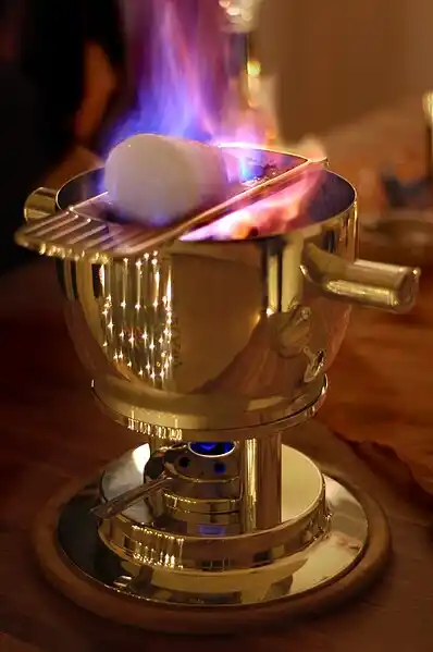 Feuerzangenbowle with the burning Zuckerhut