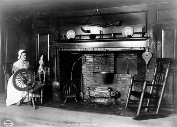 Lady spinning by the fireside