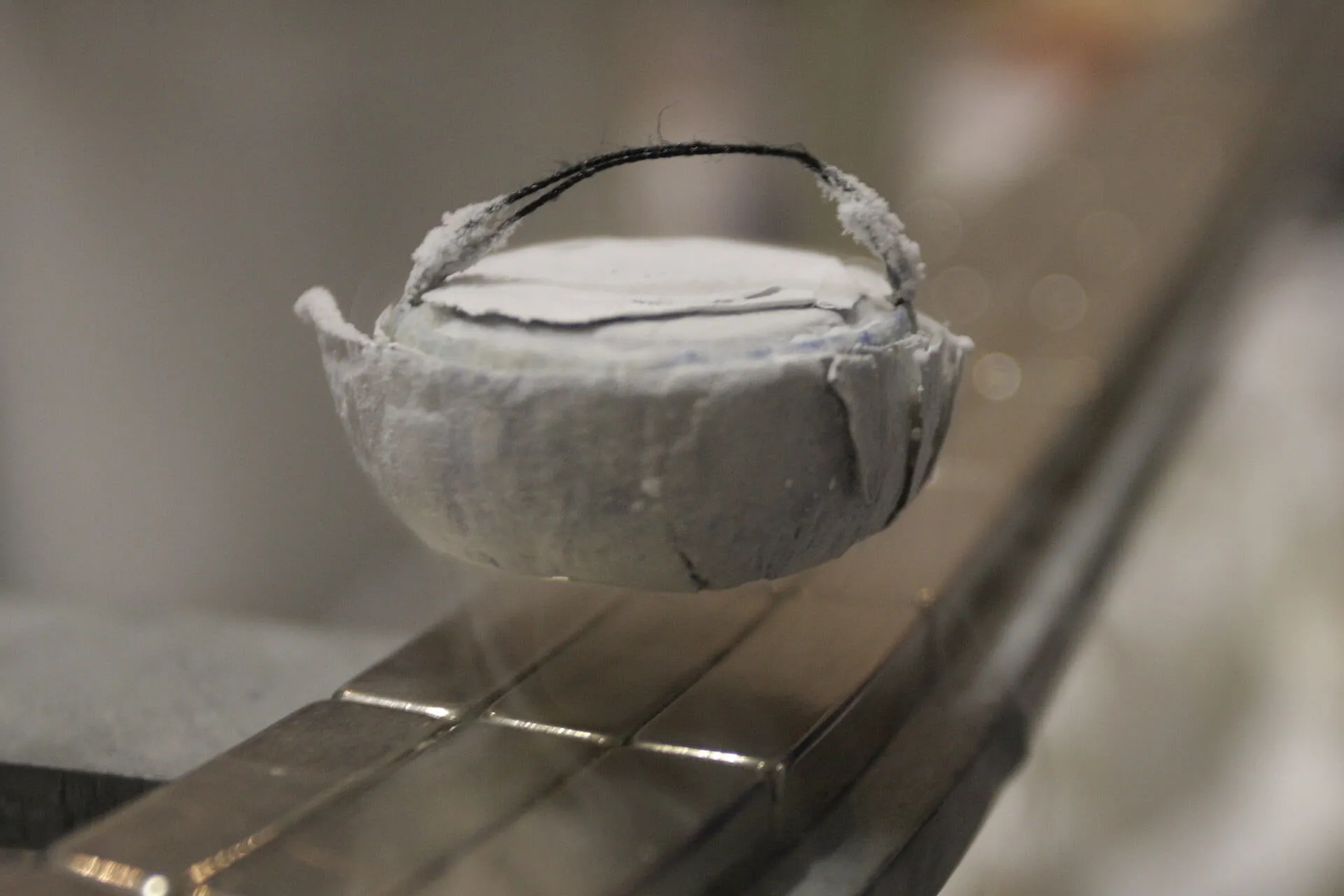 A high-temperature superconductor levitating above a magnet